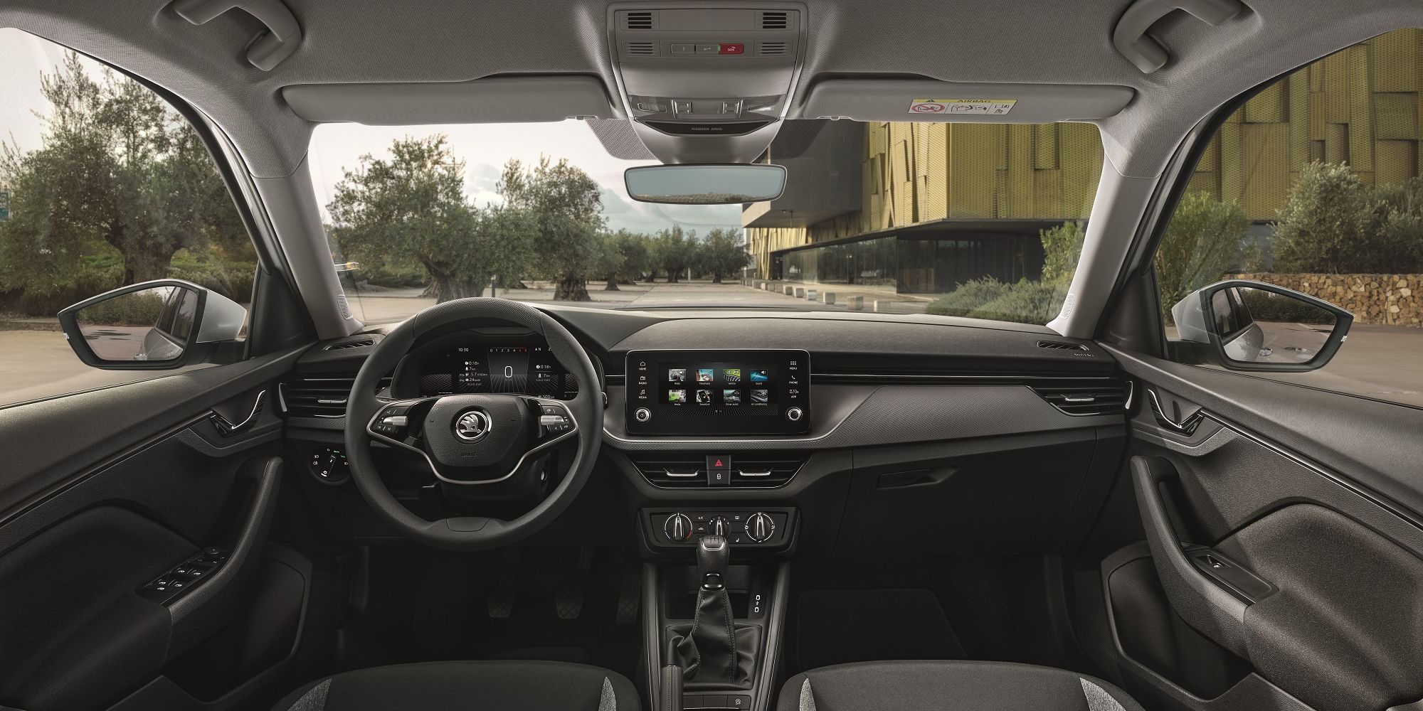 Interior of the Skoda Kamiq showing the infotainment, dashboard and steering wheel