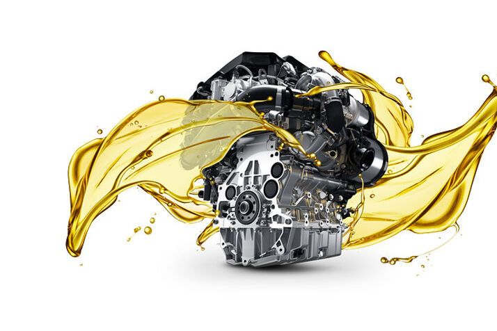 Silver car part with a splash of golden engine oil superimposed onto it