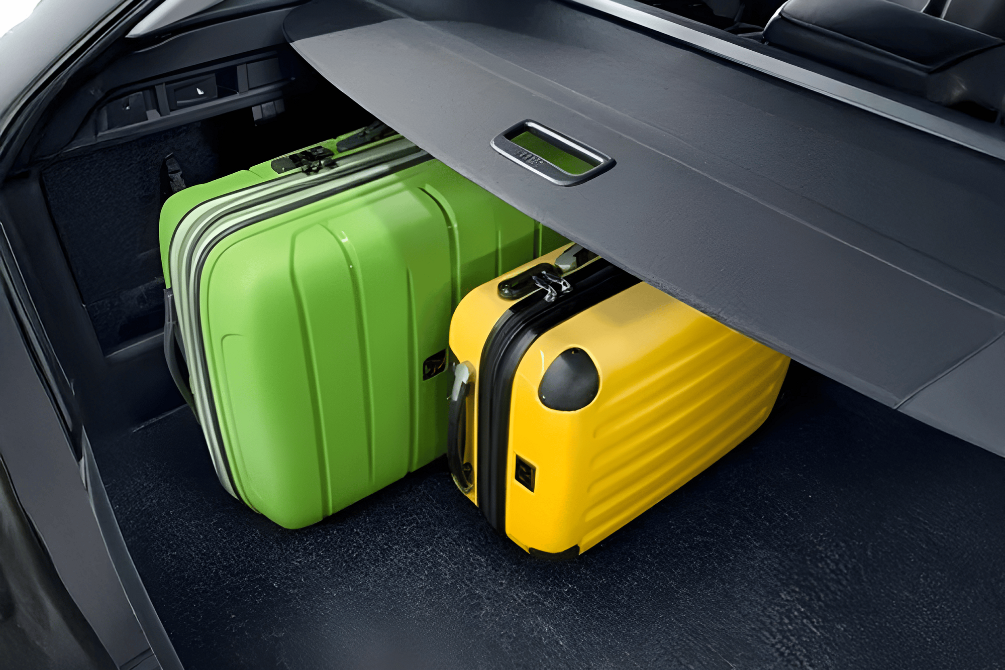 A yellow and green luggage in the Skoda car boot