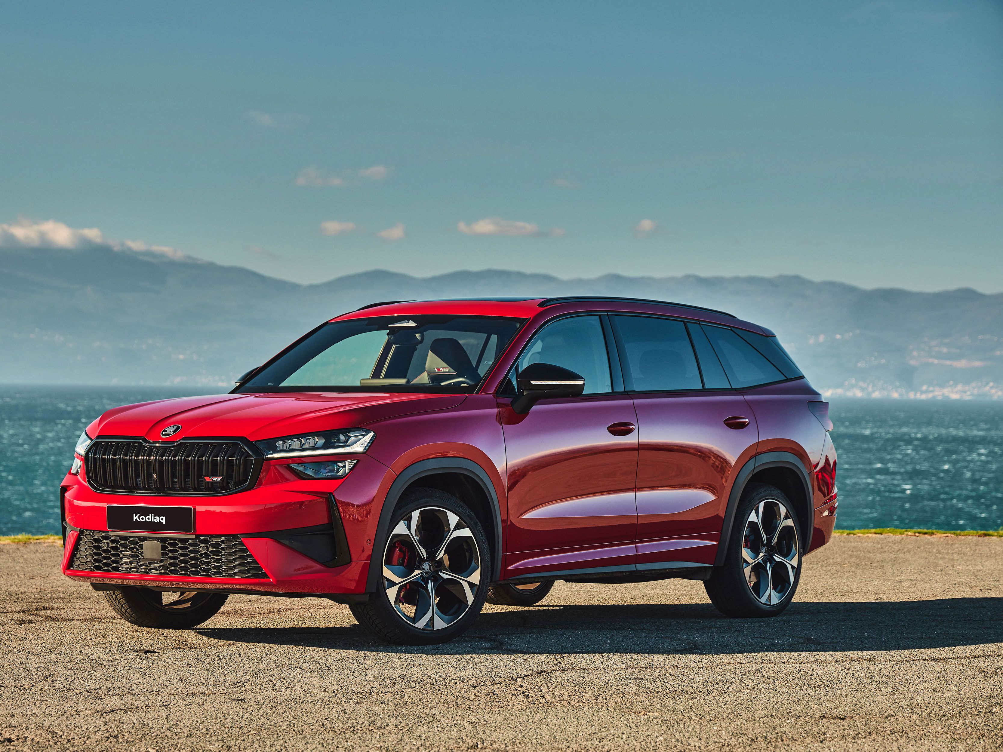 Red Kodiaq parked by the beach