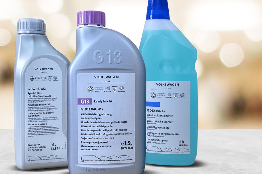 Three bottles of the Ready-to-go package solution on a grey top with warm coloured bokeh background