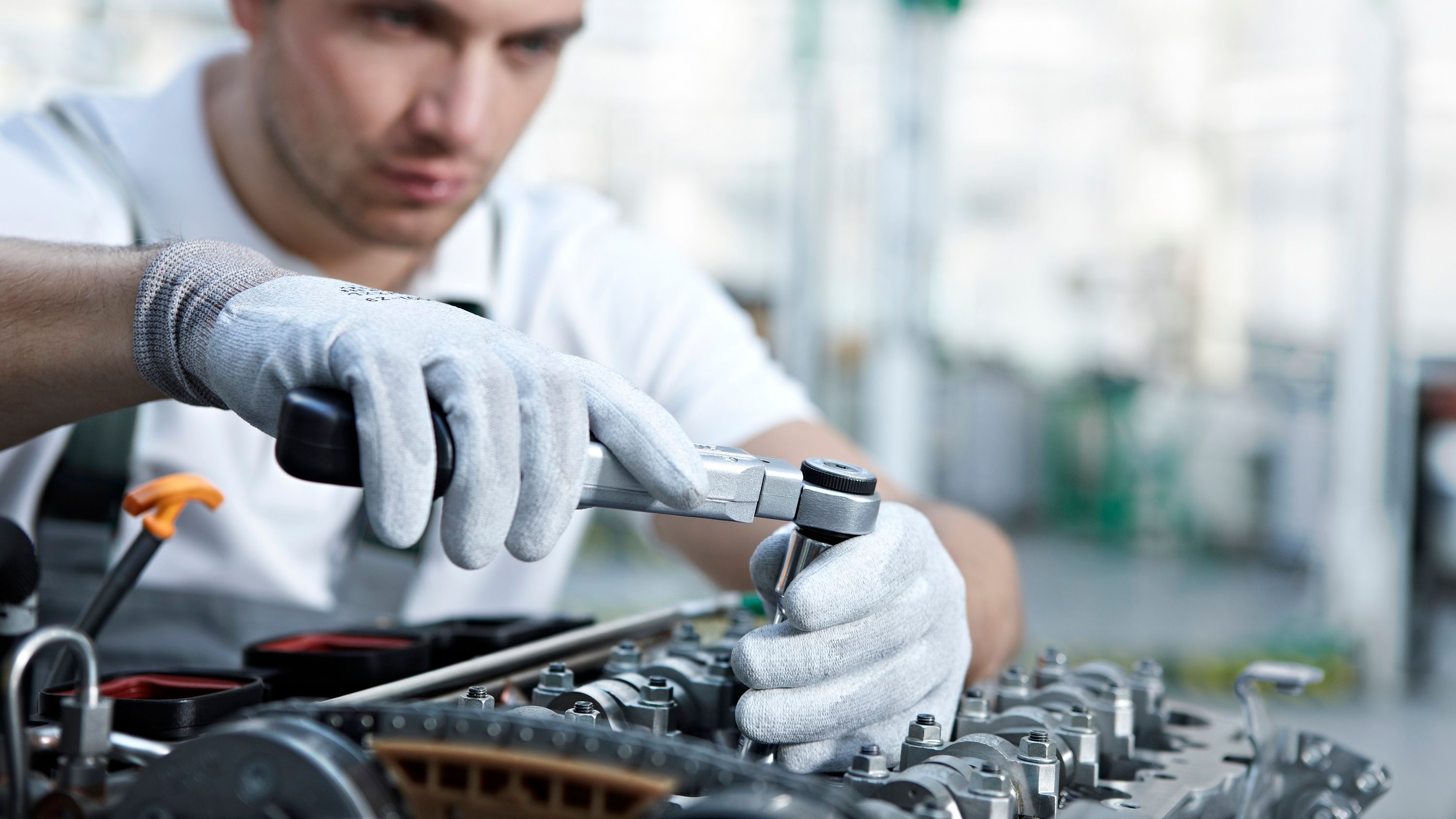 Close up shot of Skoda servicing team repairing car