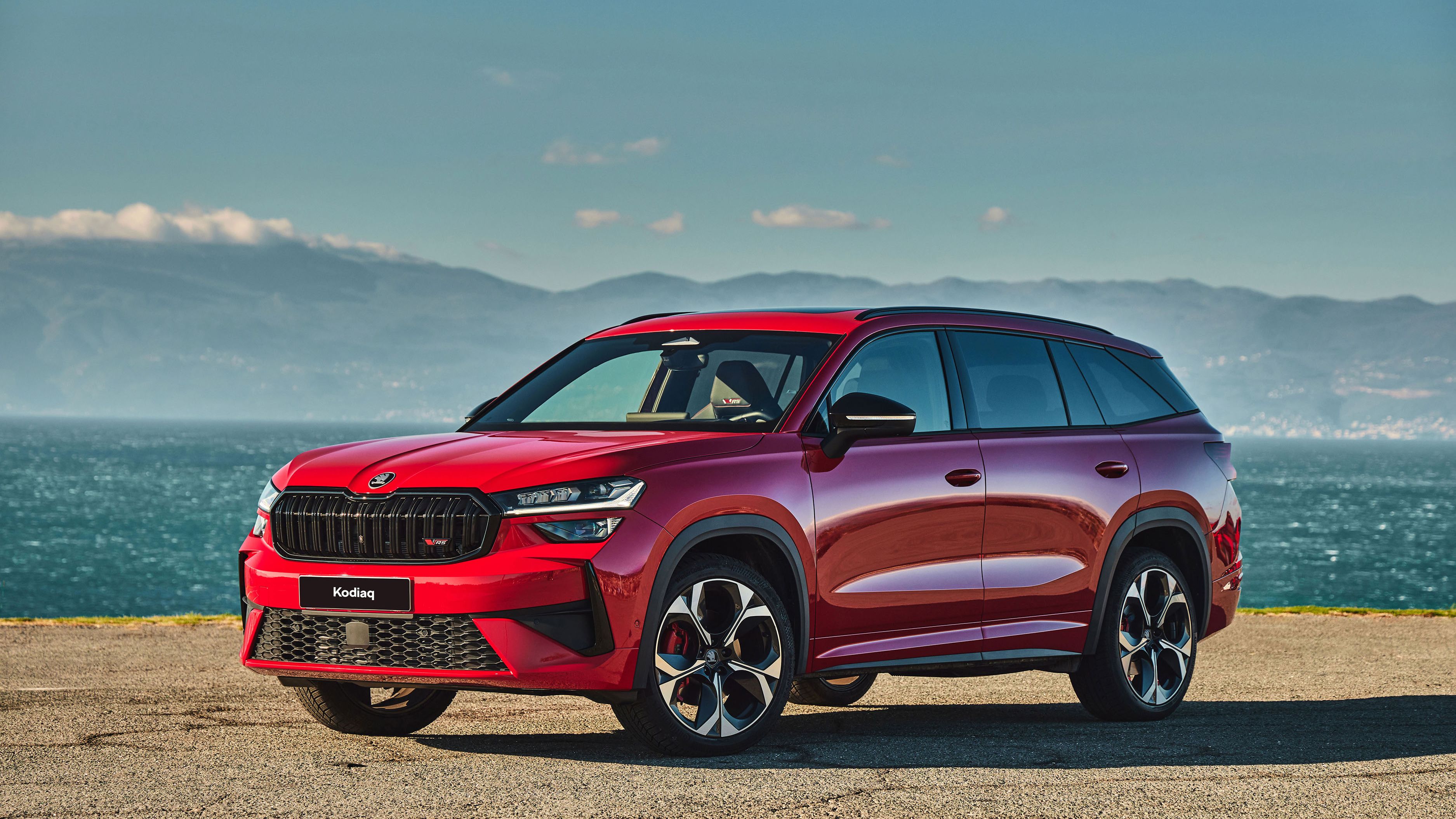 Red Kodiaq parked by the beach