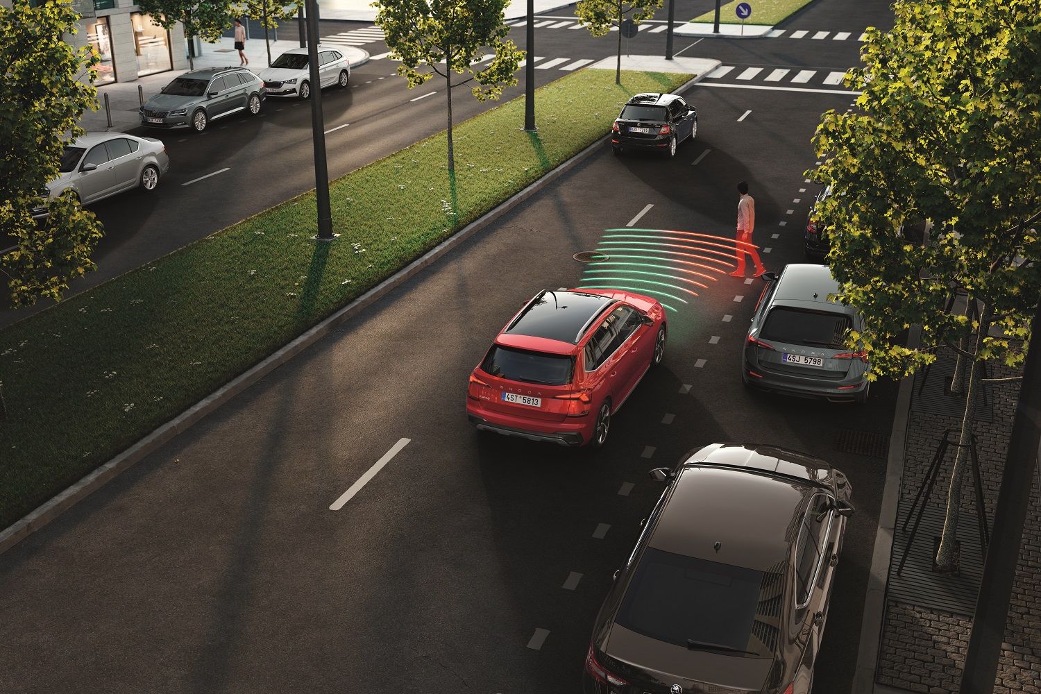 A red Skoda Superb on the road having indicator warning for incoming pedestrian from the front 