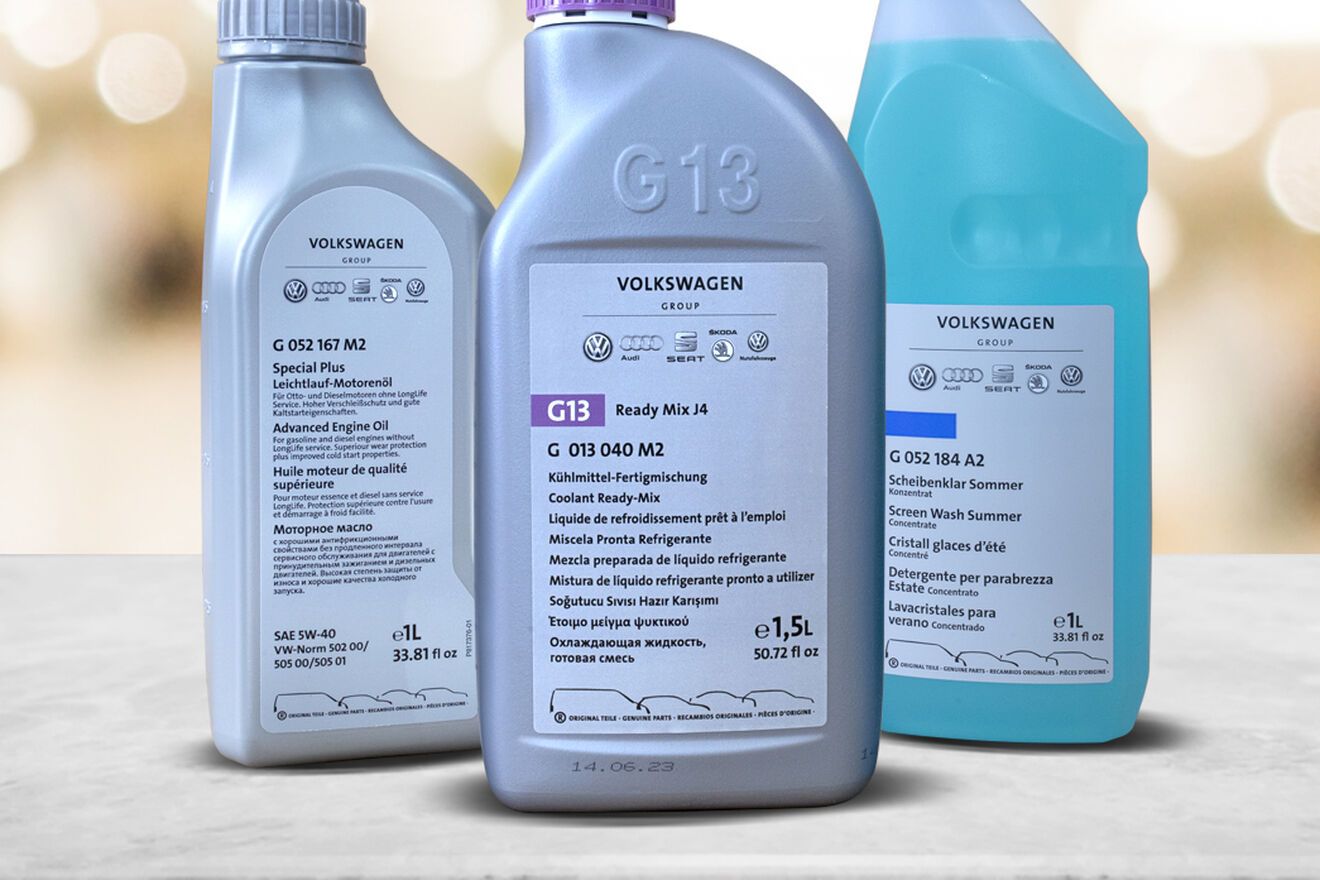 Three bottles of the Ready-to-go package solution on a grey top with warm colored bokeh background