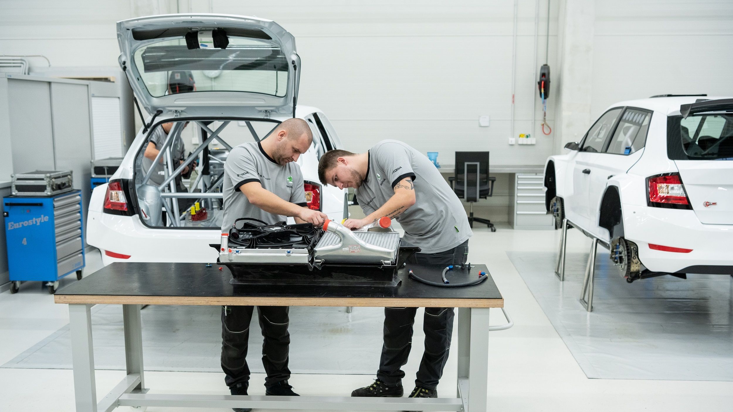 Skoda servicing team checking on car parts